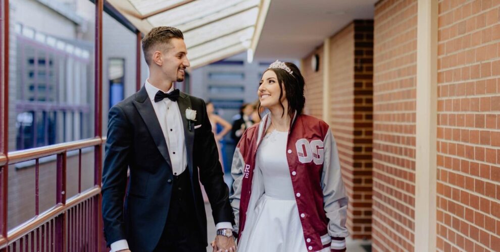 Wedding couple walk through Oakleigh Grammar
